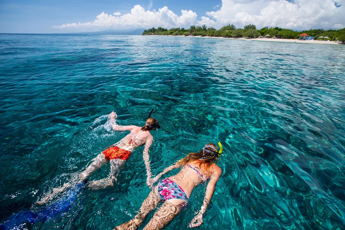 Two,Ladies,Snorkeling,In,Tropical,Sea,At,Sunny,Day